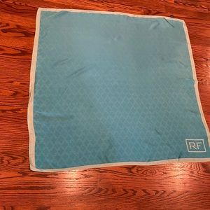 Rodan Fields Silk Scarf. Aqua and the boarder is a bluish cream color